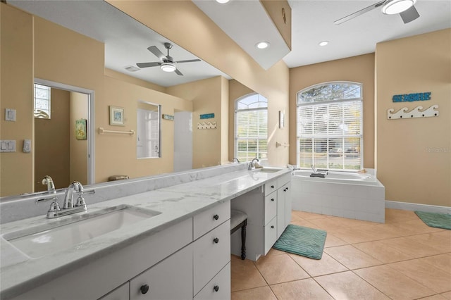 bathroom with tile patterned flooring, double vanity, ceiling fan, and a sink