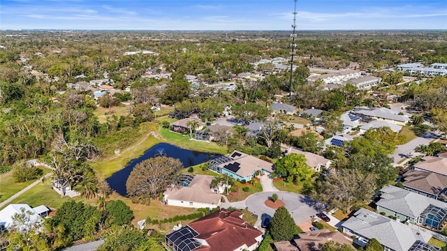 drone / aerial view featuring a residential view and a water view