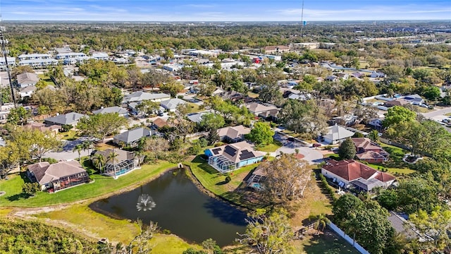 drone / aerial view featuring a water view and a residential view