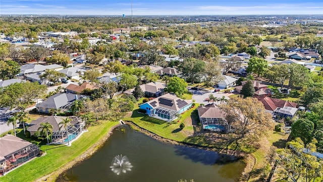 drone / aerial view with a residential view and a water view