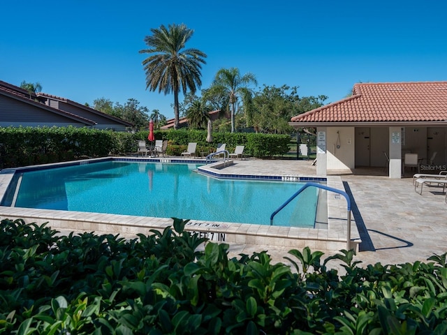 view of swimming pool featuring a patio