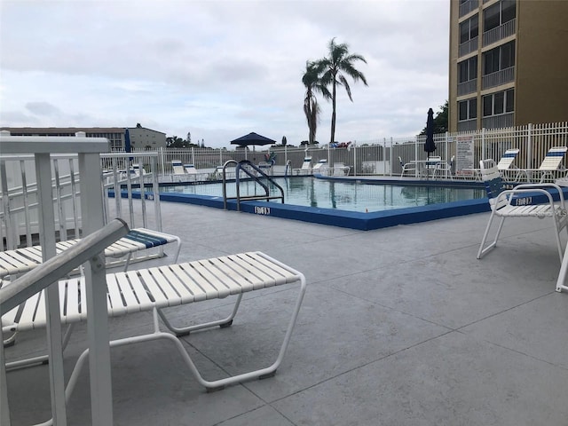 view of swimming pool featuring a patio