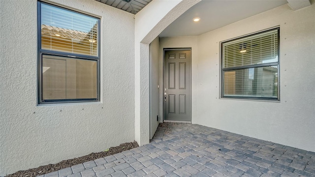 doorway to property with a patio area