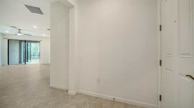 hall featuring light tile patterned floors