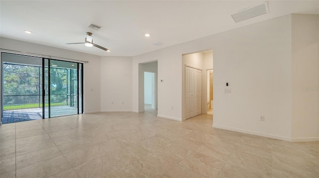 spare room with ceiling fan