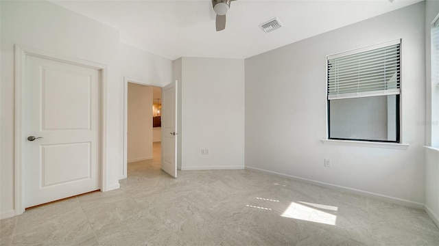 spare room featuring ceiling fan