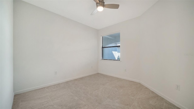 spare room with vaulted ceiling and ceiling fan