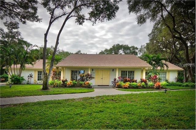 ranch-style house featuring a front lawn