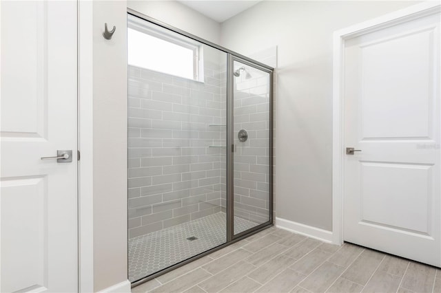 bathroom with a shower with shower door