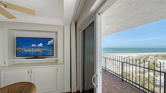 exterior space featuring a water view and ceiling fan