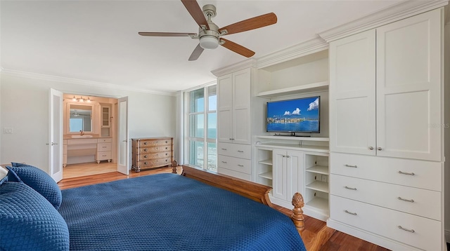 bedroom featuring ensuite bath, ceiling fan, crown molding, and dark hardwood / wood-style floors