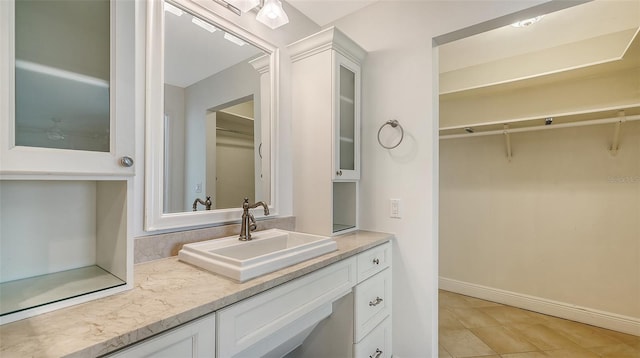 bathroom with vanity and tile patterned floors