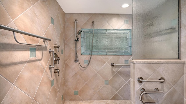 bathroom with a tile shower