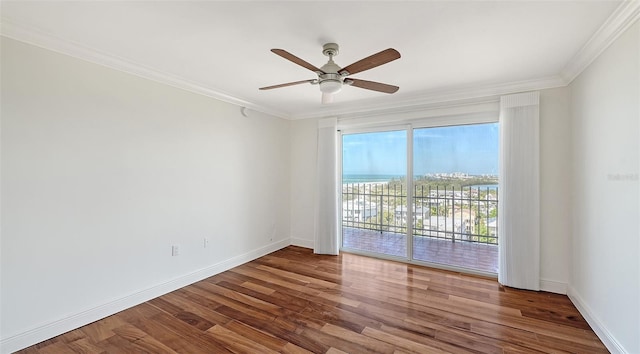 unfurnished room with crown molding, ceiling fan, and wood-type flooring