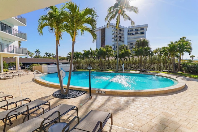 view of swimming pool featuring a patio area