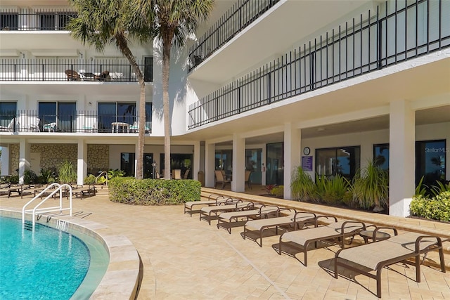 view of swimming pool featuring a patio