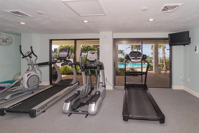 workout area with a textured ceiling