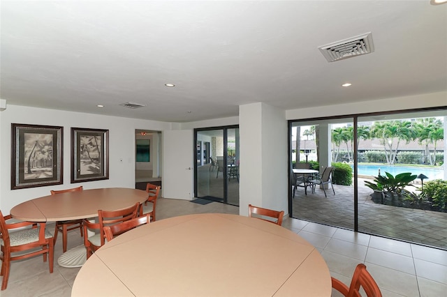 dining space with light tile patterned flooring