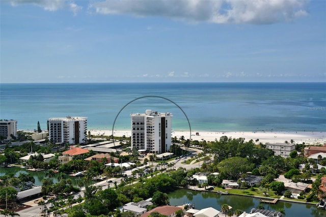 bird's eye view with a water view and a beach view