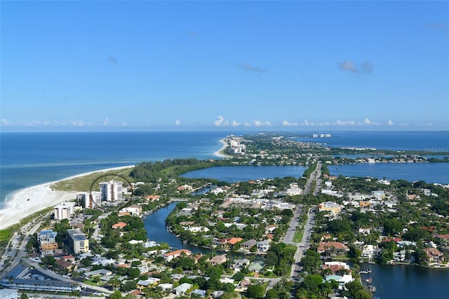 aerial view with a water view and a beach view