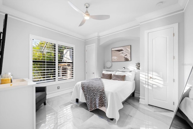 bedroom featuring ornamental molding and ceiling fan