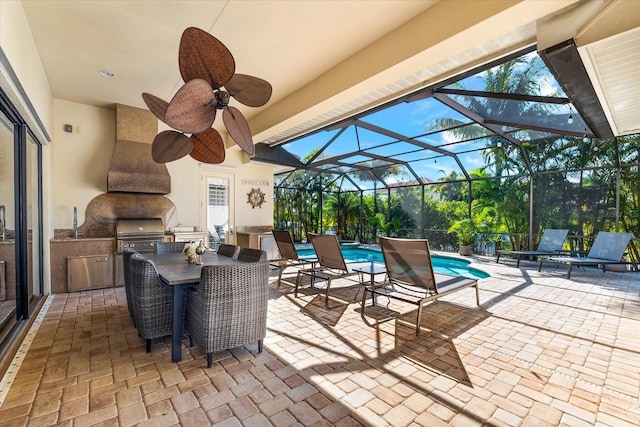 view of patio / terrace with grilling area, area for grilling, and glass enclosure