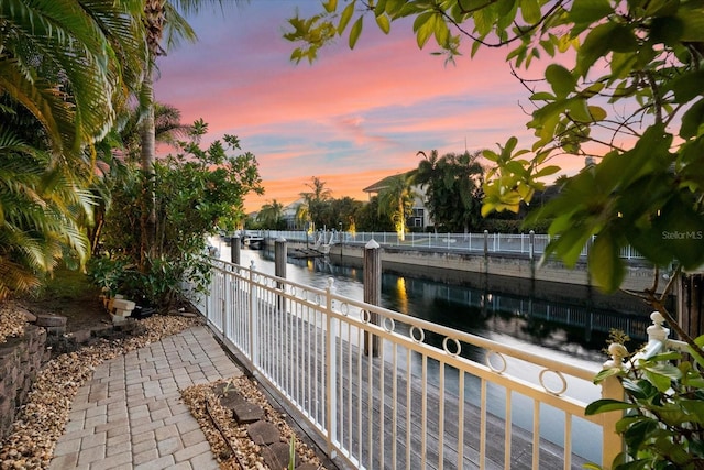 balcony at dusk with a water view