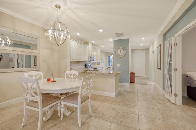 tiled dining area featuring a chandelier and crown molding