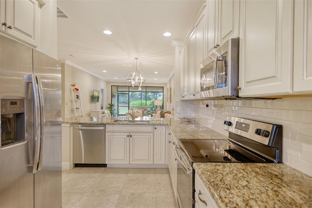 kitchen featuring white cabinets, stainless steel appliances, and an inviting chandelier