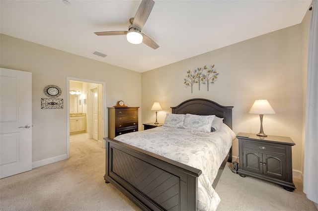 carpeted bedroom with connected bathroom and ceiling fan