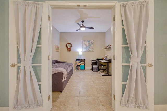 tiled bedroom with ceiling fan