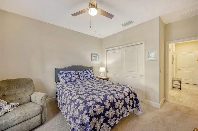 carpeted bedroom featuring a closet and ceiling fan