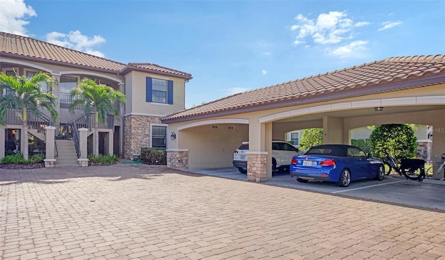 mediterranean / spanish-style home featuring a carport