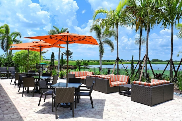 view of patio featuring a water view and an outdoor hangout area