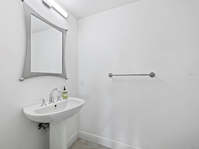 bathroom with a textured ceiling