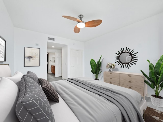 bedroom with wood-type flooring and ceiling fan