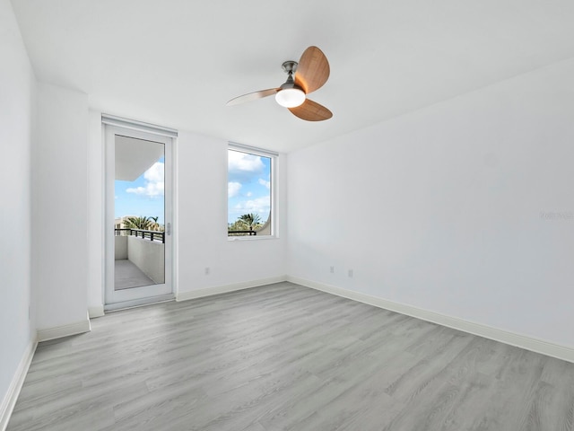 unfurnished room with ceiling fan and light hardwood / wood-style flooring