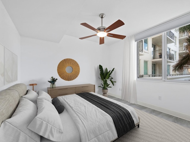 bedroom featuring hardwood / wood-style floors and ceiling fan