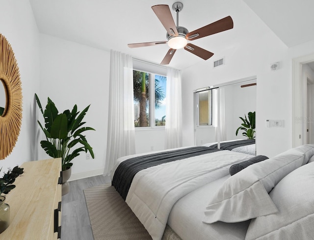 bedroom featuring light hardwood / wood-style floors and ceiling fan