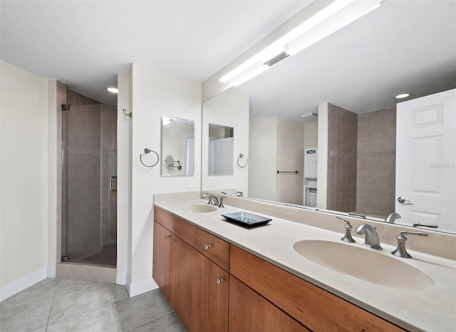 bathroom featuring tile patterned floors, vanity, and an enclosed shower