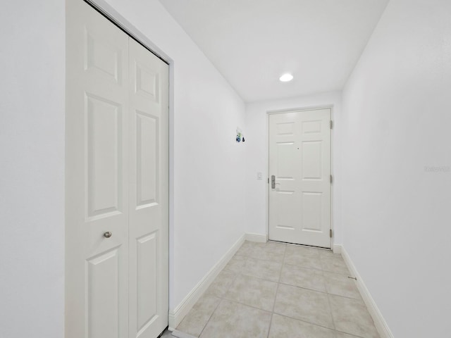 hallway featuring light tile patterned floors