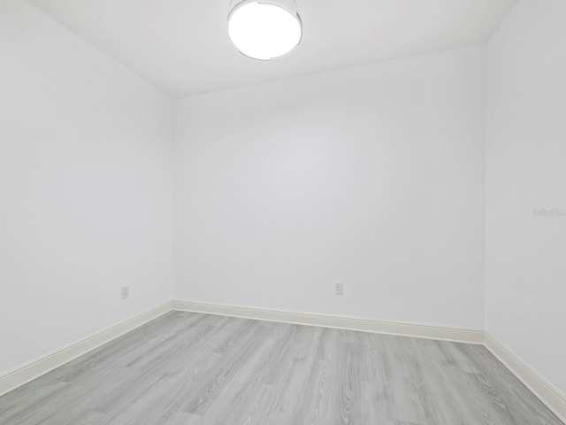 spare room featuring light hardwood / wood-style flooring