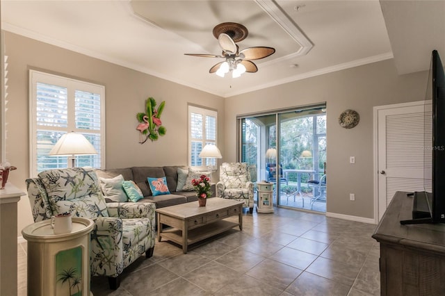 tiled living room with ceiling fan and crown molding