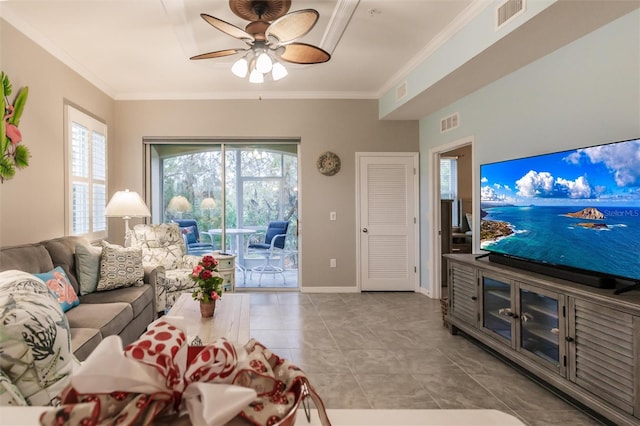 living room featuring ceiling fan, a healthy amount of sunlight, and ornamental molding