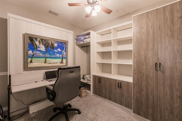 home office featuring ceiling fan and light colored carpet