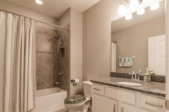 full bathroom with shower / tub combo, vanity, and toilet