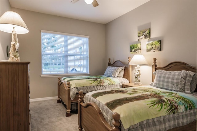 bedroom featuring light carpet and ceiling fan