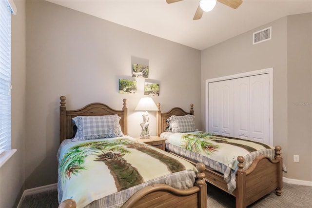 bedroom featuring multiple windows, ceiling fan, a closet, and carpet floors