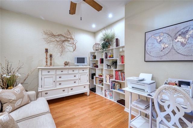 sitting room featuring light wood-type flooring and ceiling fan