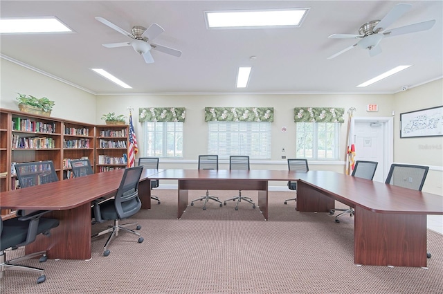 carpeted office space with ceiling fan and ornamental molding